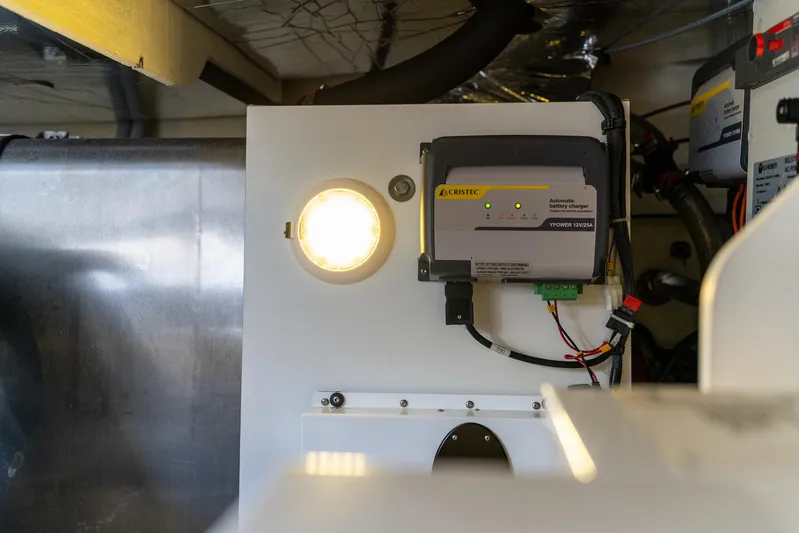 Living Out Loud Yacht Photos Pics Engine room of a 2020 Prestige 420 yacht with electrical components and lighting.