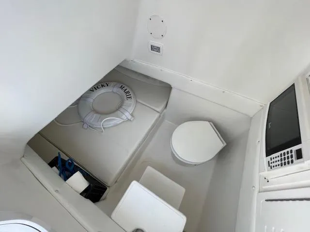  Yacht Photos Pics Interior of 2020 SeaHunter 39 Tournament boat with seating, toilet, and life preserver.