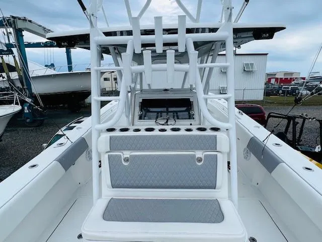  Yacht Photos Pics 2020 SeaHunter 39 Tournament boat interior with rod holders and seating, docked at a marina.