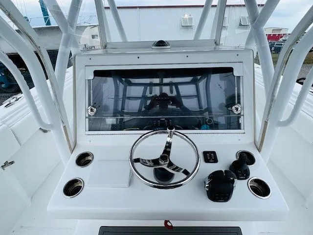  Yacht Photos Pics 2020 SeaHunter 39 Tournament boat console with steering wheel and controls.
