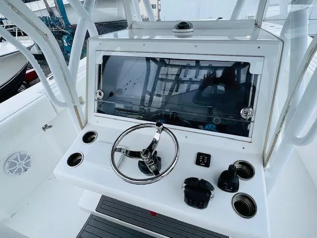  Yacht Photos Pics 2020 SeaHunter 39 Tournament boat helm with steering wheel and control panel.