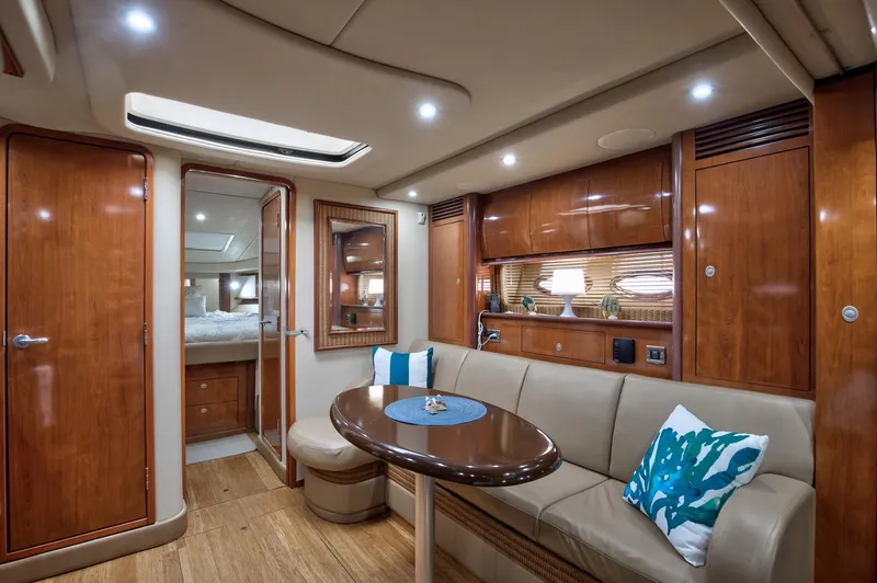 Sarah Jane III Yacht Photos Pics Luxurious interior of 2005 Sea Ray 390 Sundancer yacht with elegant wood finishes.