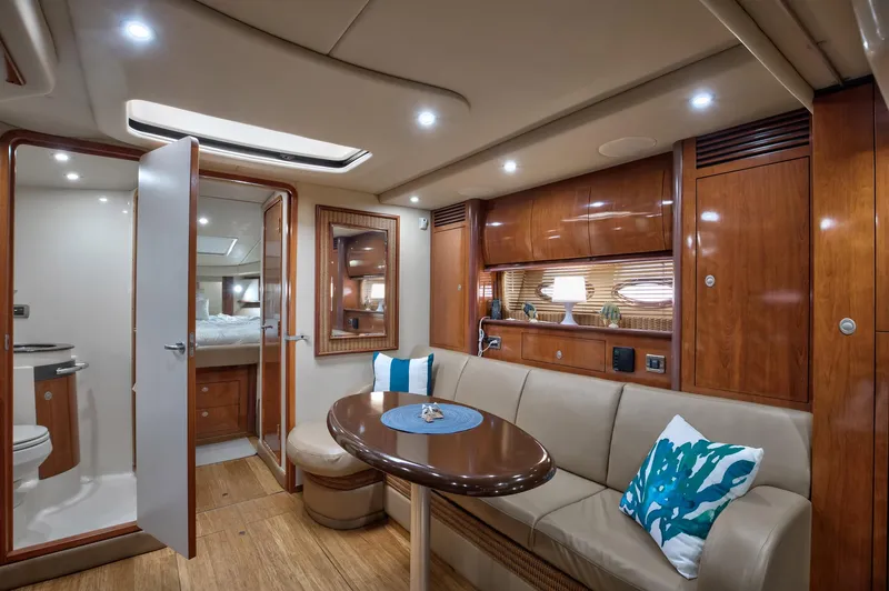 Sarah Jane III Yacht Photos Pics Luxurious interior of 2005 Sea Ray 390 Sundancer yacht with elegant wood finishes.