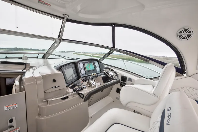 Sarah Jane III Yacht Photos Pics Interior view of 2005 Sea Ray 390 Sundancer yacht cockpit with modern navigation equipment.