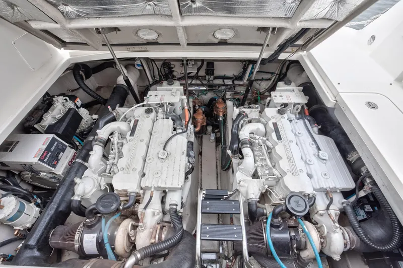 Sarah Jane III Yacht Photos Pics Engine compartment of 2005 Sea Ray 390 Sundancer with dual engines and mechanical components.