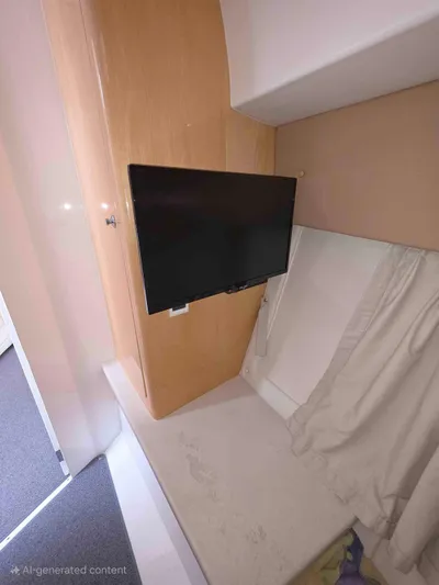  Yacht Photos Pics Interior cabin of 2008 Intrepid 430 Sport Yacht with mounted TV and bed.