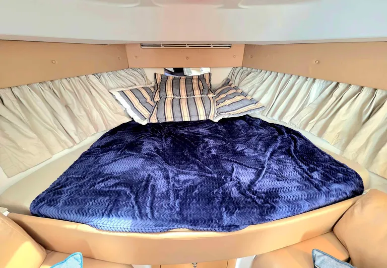  Yacht Photos Pics Luxurious cabin interior of 2008 Intrepid 430 Sport Yacht with plush bedding and elegant decor.