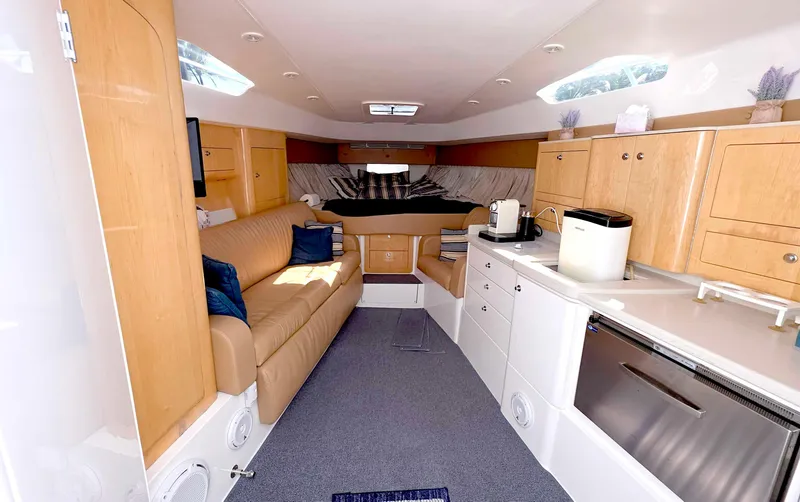 Yacht Photos Pics Interior of 2008 Intrepid 430 Sport Yacht with modern kitchen and cozy seating area.
