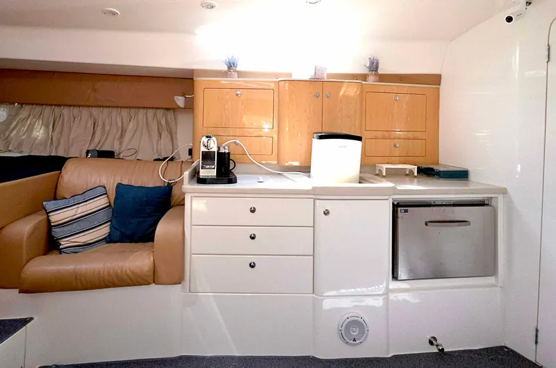  Yacht Photos Pics Interior of 2008 Intrepid 430 Sport Yacht with kitchenette and seating area.