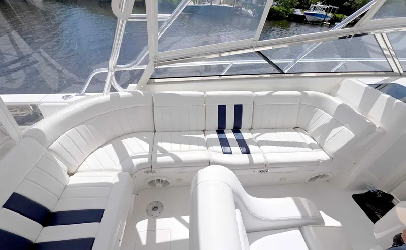  Yacht Photos Pics 2008 Intrepid 430 Sport Yacht interior with white and blue seating, overlooking water.