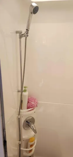  Yacht Photos Pics Shower area in 2008 Intrepid 430 Sport Yacht with handheld showerhead and toiletries.