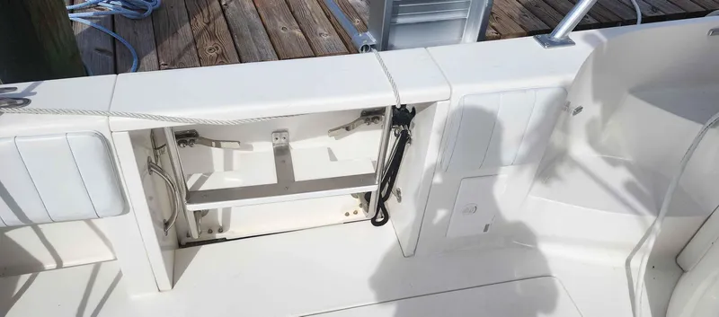  Yacht Photos Pics 2008 Intrepid 430 Sport Yacht deck with open storage compartment and clean white finish.