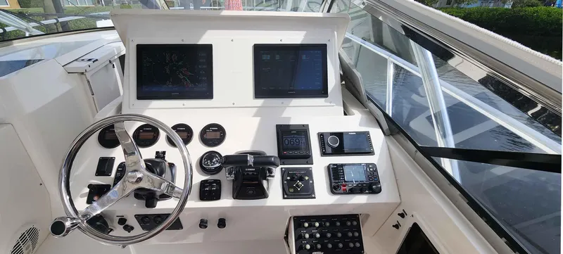 Yacht Photos Pics Helm of 2008 Intrepid 430 Sport Yacht with dual screens and navigation controls.