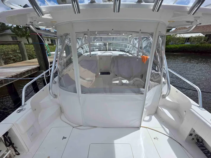  Yacht Photos Pics 2008 Intrepid 430 Sport Yacht with enclosed cockpit, docked by a serene waterfront.