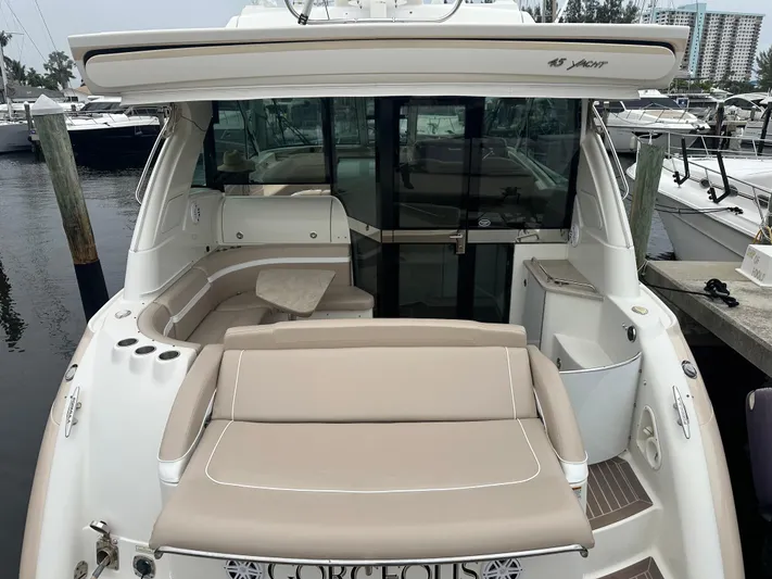 Gorgeous Yacht Photos Pics 2015 Formula 45 Yacht with beige seating, docked at a marina.