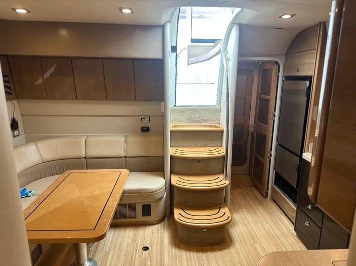 Gorgeous Yacht Photos Pics Interior of 2015 Formula 45 Yacht featuring elegant wood finishes and a cozy seating area.