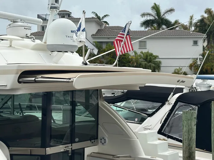 Gorgeous Yacht Photos Pics 2015 Formula 45 Yacht docked, featuring radar equipment and American flag.