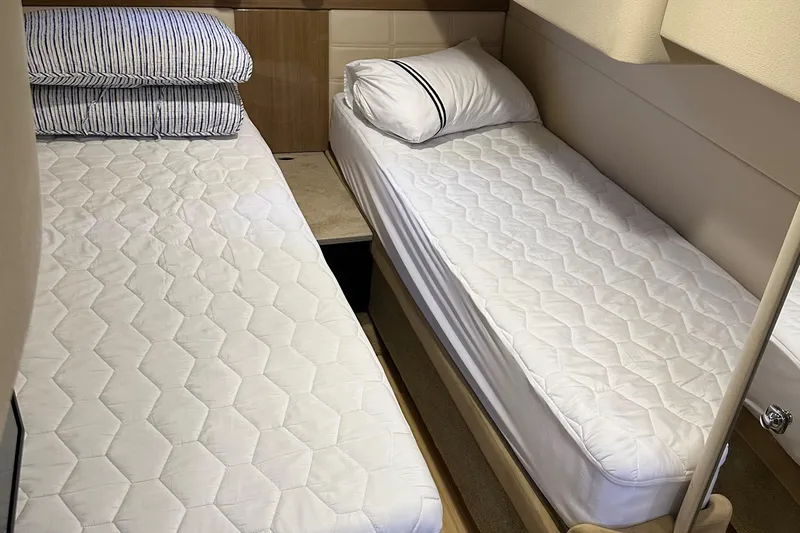 Gorgeous Yacht Photos Pics Twin beds in the cabin of a 2015 Formula 45 Yacht.