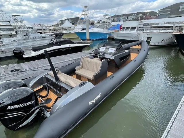  Yacht Photos Pics 2022 Roughneck RIB 1010 boat docked, featuring Mercury engines, in a marina setting.
