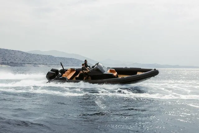  Yacht Photos Pics Roughneck RIB 1010 boat cruising on open water, 2022 model.