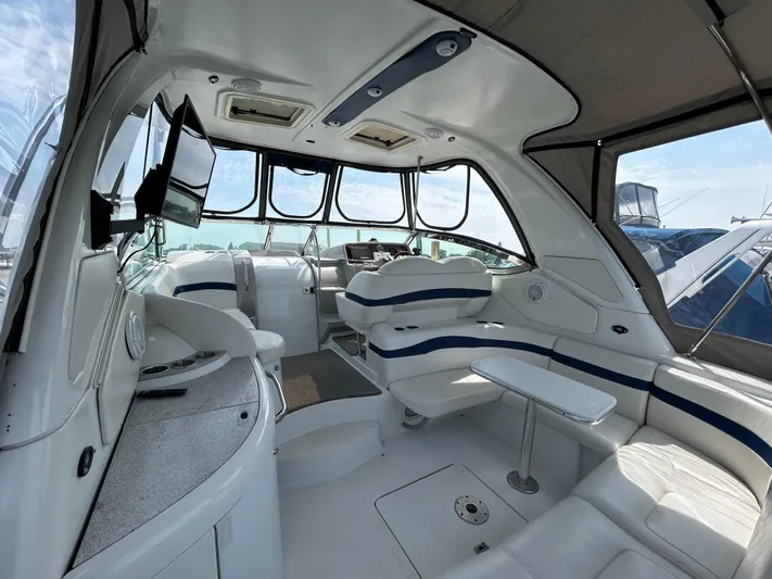  Yacht Photos Pics Interior of a 2005 Formula 37 PC yacht with seating and a table.