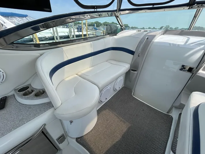  Yacht Photos Pics 2005 Formula 37 PC boat interior with white seating and cup holders.