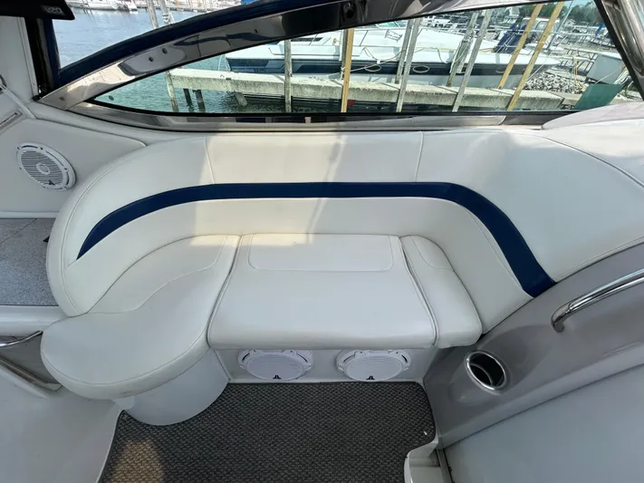  Yacht Photos Pics 2005 Formula 37 PC yacht interior with white and blue seating, docked at marina.
