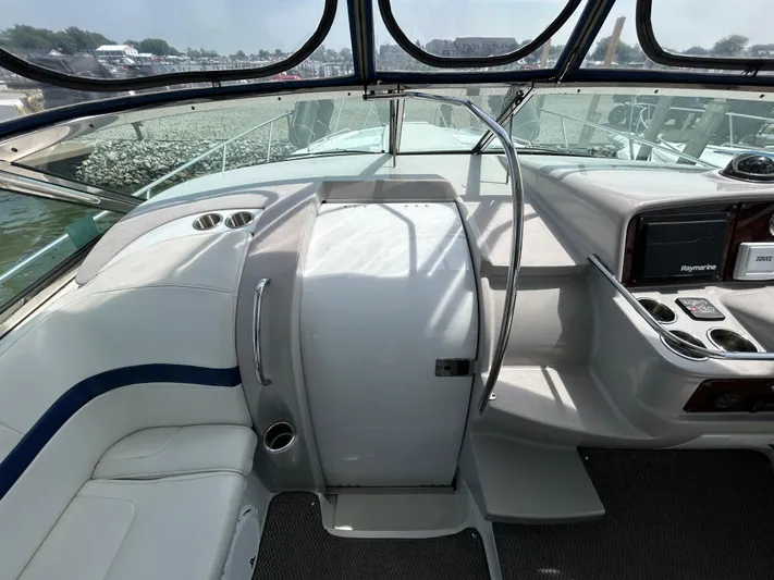  Yacht Photos Pics 2005 Formula 37 PC boat interior with helm, seating, and control panel.