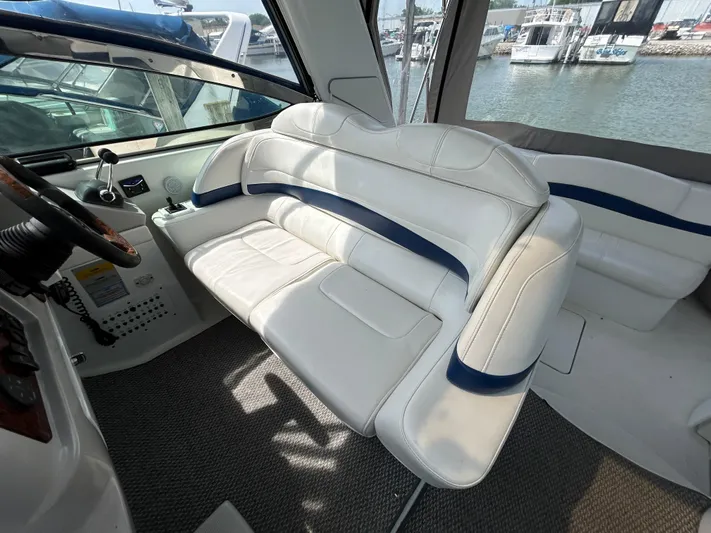  Yacht Photos Pics 2005 Formula 37 PC yacht interior with white seating and marina view.