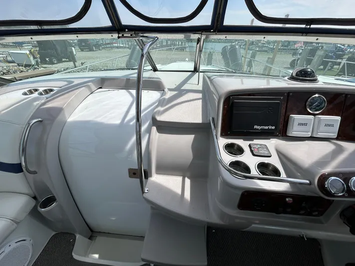  Yacht Photos Pics 2005 Formula 37 PC boat helm with Raymarine system and cup holders.