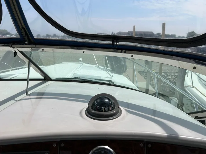  Yacht Photos Pics 2005 Formula 37 PC boat cockpit with compass and windshield view.