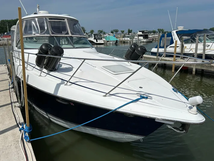  Yacht Photos Pics 2005 Formula 37 PC boat docked at marina, featuring sleek design and white exterior.