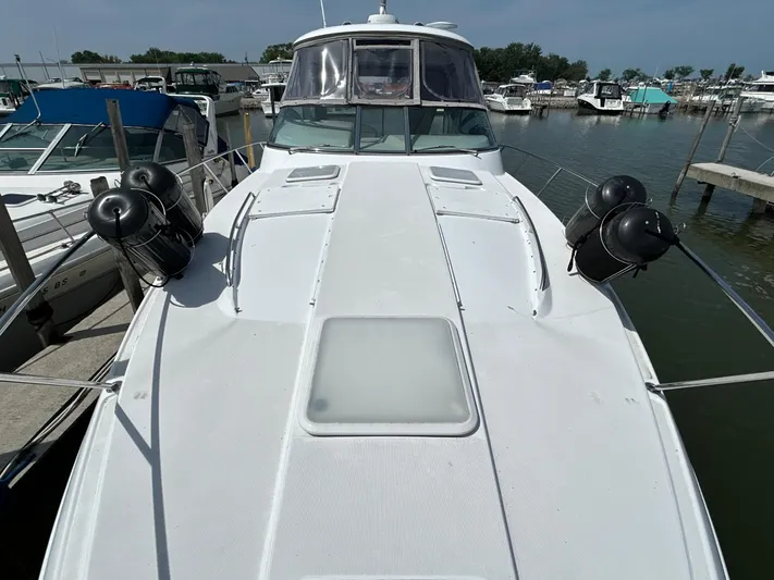  Yacht Photos Pics 2005 Formula 37 PC boat docked at marina, view of deck and surrounding watercraft.