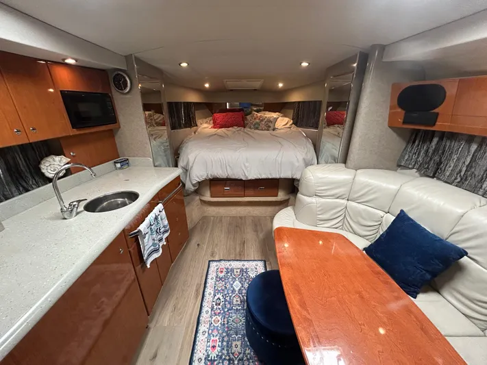  Yacht Photos Pics Luxurious interior of a 2005 Formula 37 PC yacht with cozy bed and kitchenette.