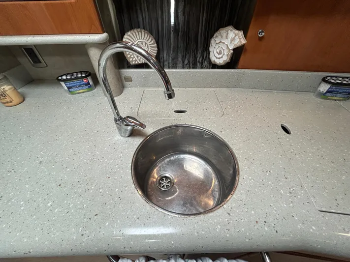  Yacht Photos Pics 2005 Formula 37 PC yacht kitchen sink with modern faucet and countertop.