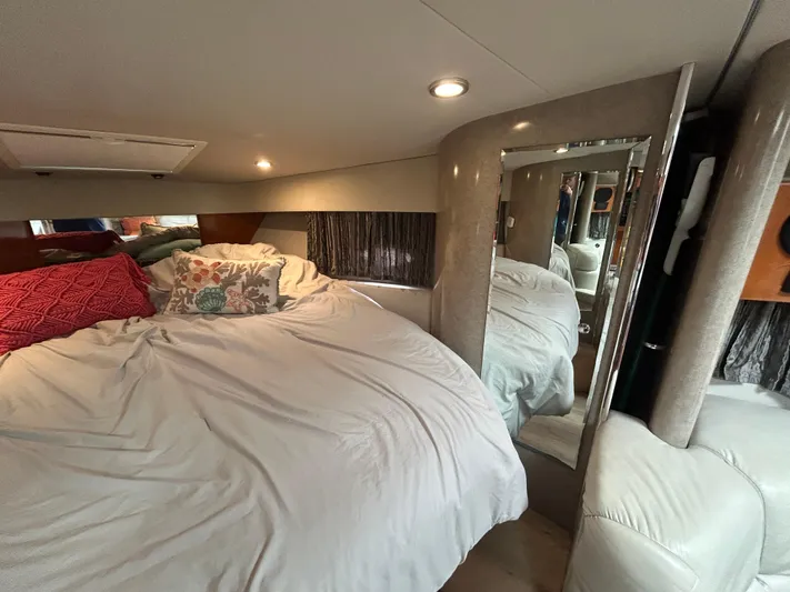  Yacht Photos Pics Interior of 2005 Formula 37 PC yacht with cozy bed and decorative pillows.