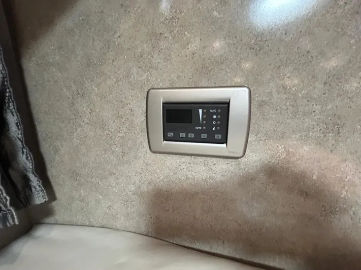  Yacht Photos Pics Control panel on beige wall inside 2005 Formula 37 PC boat cabin.