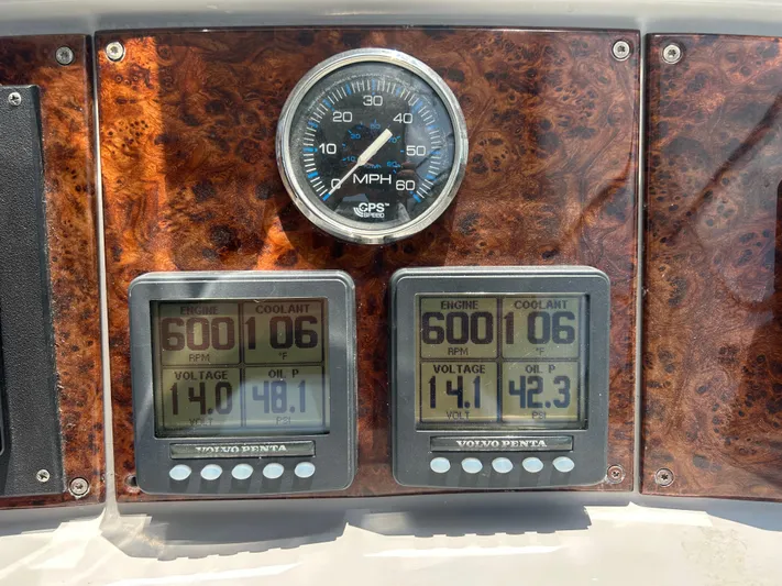  Yacht Photos Pics Dashboard of a 2005 Formula 37 PC boat with engine gauges and speedometer.