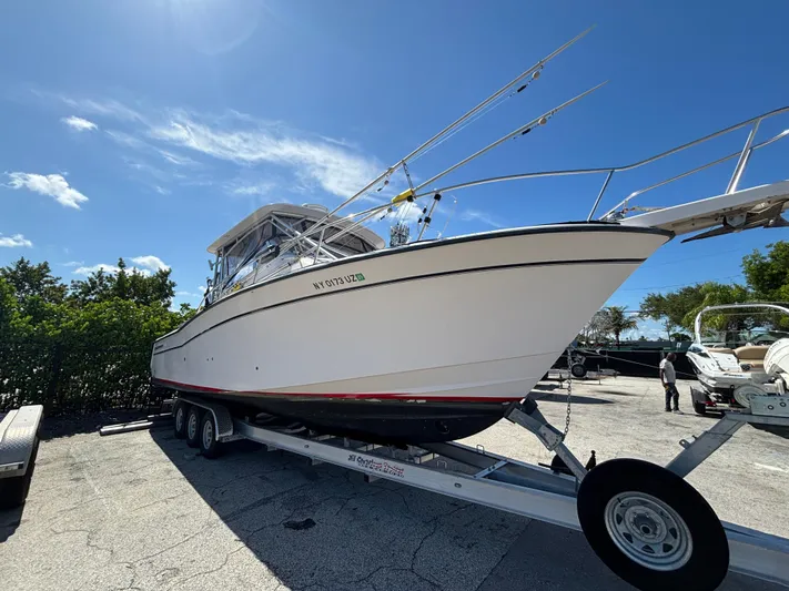 Kahuna Yacht Photos Pics 2002 Grady-White Express 330 boat on trailer under clear blue sky.