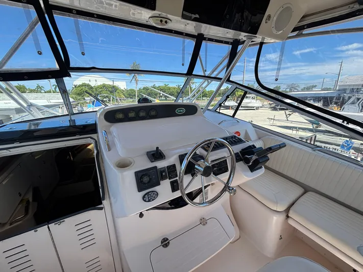 Kahuna Yacht Photos Pics Helm of 2002 Grady-White Express 330 boat with steering wheel and controls.