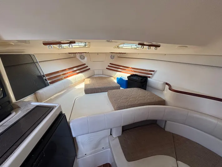 Kahuna Yacht Photos Pics 2002 Grady-White Express 330 cabin interior with seating and storage.