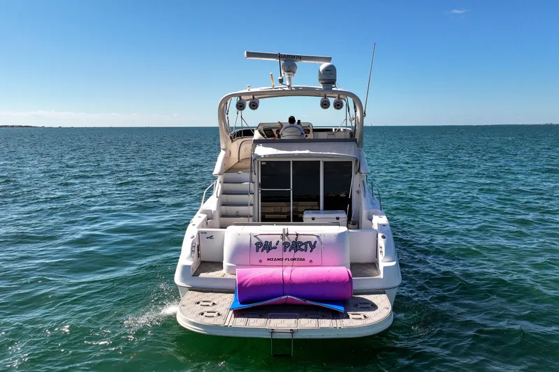 Pal'party Yacht Photos Pics 2000 Sea Ray 450 Express Bridge yacht on open water, rear view.