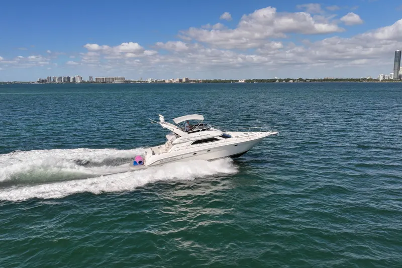 Pal'party Yacht Photos Pics 2000 Sea Ray 450 Express Bridge cruising on open water under a clear blue sky.