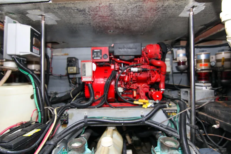 Pal'party Yacht Photos Pics Engine room of 2000 Sea Ray 450 Express Bridge with red generator and wiring.