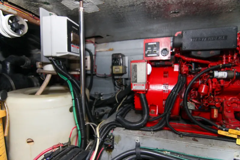 Pal'party Yacht Photos Pics Engine room of 2000 Sea Ray 450 Express Bridge with red machinery and wiring.