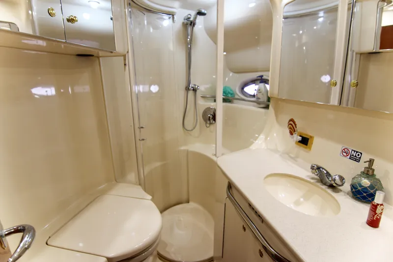 Pal'party Yacht Photos Pics Luxurious bathroom in 2000 Sea Ray 450 Express Bridge yacht with shower and vanity.