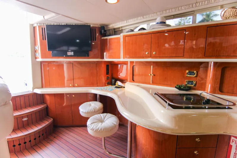 Pal'party Yacht Photos Pics Luxurious interior of 2000 Sea Ray 450 Express Bridge yacht with modern amenities.