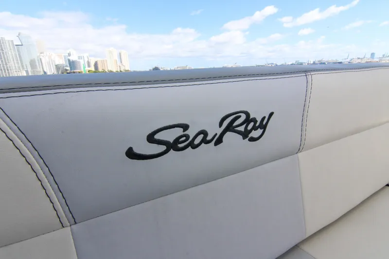 Pal'party Yacht Photos Pics Sea Ray 450 Express Bridge 2000 boat interior with city skyline in background.