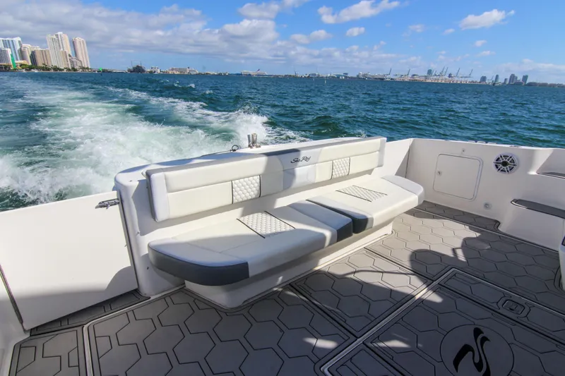 Pal'party Yacht Photos Pics 2000 Sea Ray 450 Express Bridge cruising with city skyline in background.