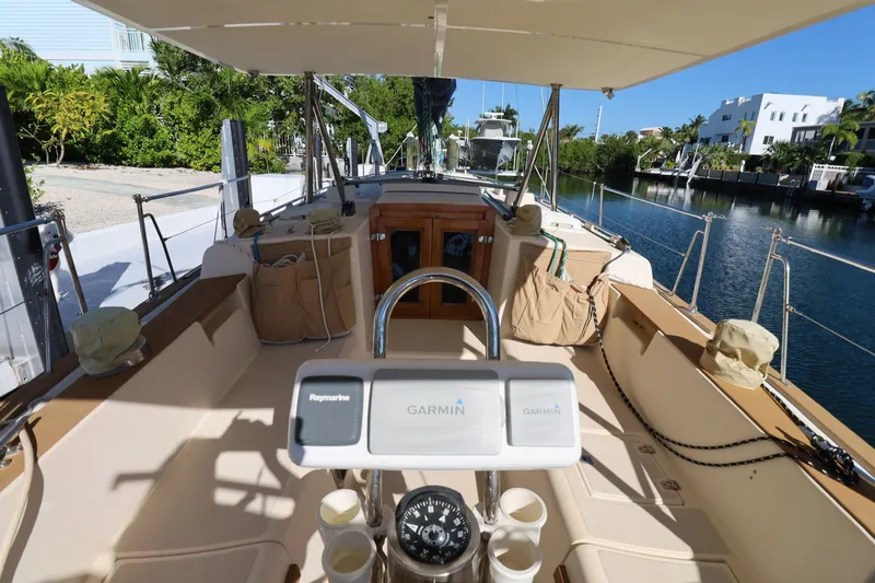 Inspiration Yacht Photos Pics 1989 Island Packet 38 sailboat cockpit with Garmin navigation, docked by a canal.